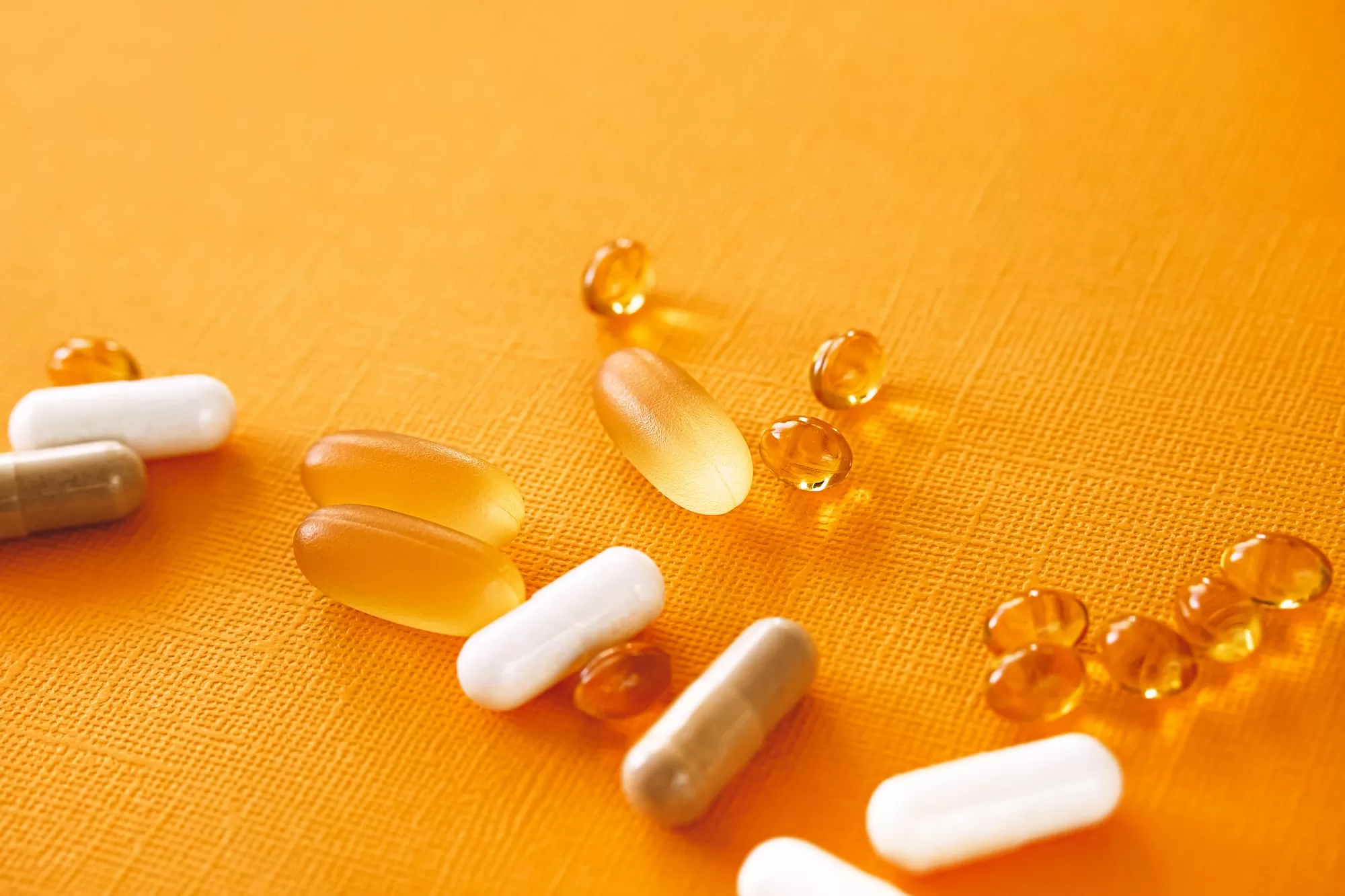 Nutraceuticals,pills and medications on yellow background