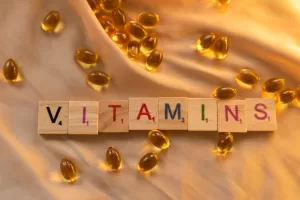 Vitamine and pills on satin background